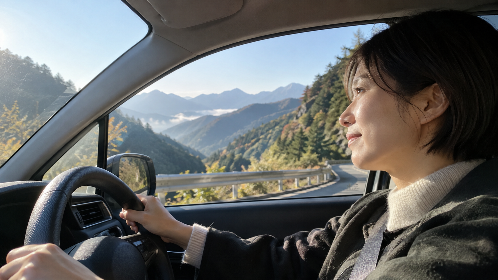 長野の教員が朝、山あいの峠道を車で学校へ向かう30代の先生(イメージ)
